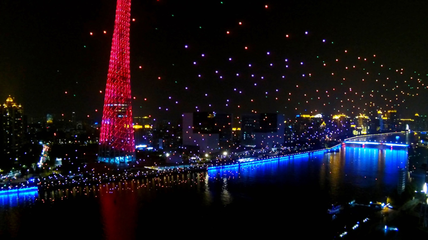 The “Meteor Sky” 1000 UAV formation reflecting the night view of the Canton Tower and the Pearl River
